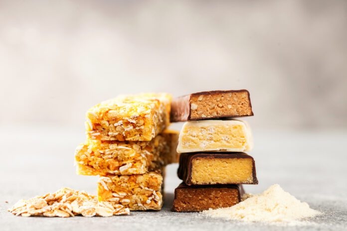 Different,Energy,Protein,Bars,And,Oatmeal,Bars,On,Grey,Background.
